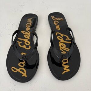 Sam Edelman Black Jelly Flip Flops with Gold Script